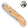 Knife with badge embedded